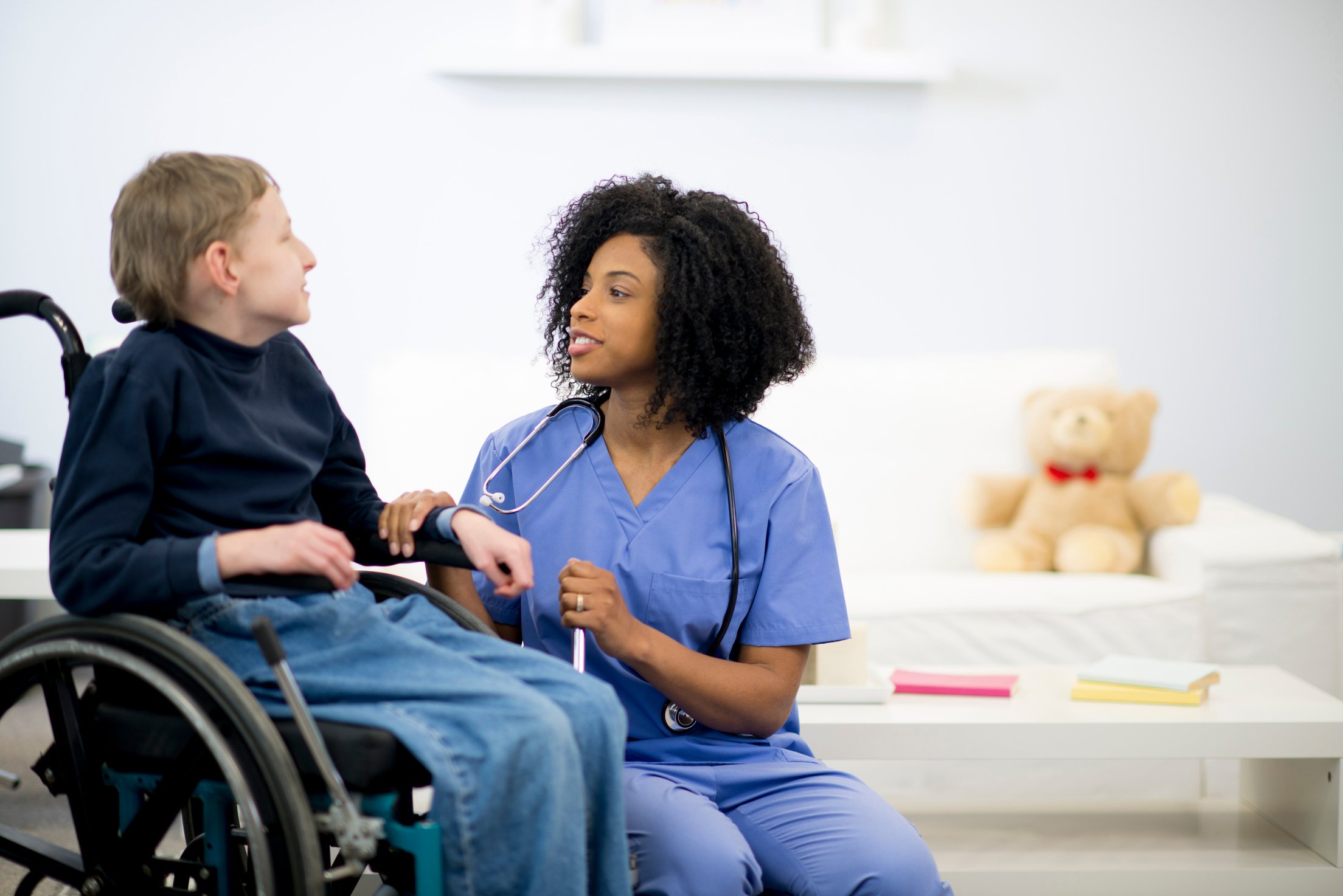 Nurse Working with a Disabled Child